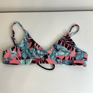 pink bikini top with teal feathers and burgundy and black leaves
